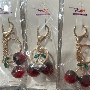 6 cherry charms with gold hardware